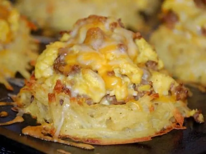Scrambled Eggs and Sausage in Potato Nests