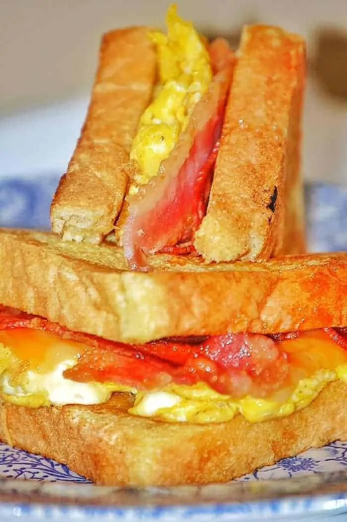 French Toast Sandwich Recipe - Voted Kid's Favorite Breakfast and easiest for moms! Bacon, Eggs, French Toast, and Cheese? Yes please! | faithfullyfree.com