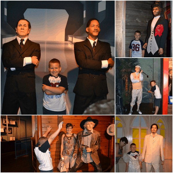 posing with Will Smith, Johnny Depp, and Owen Wilson wax figures at Hollywood Wax Museum Branson, MO
