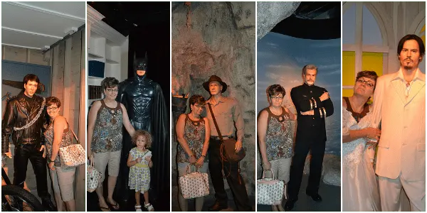posing with Sean Connery, Nicolas Cage, Batman, Johnny Depp, and Harrison Ford wax figures at Hollywood Wax Museum Branson, MO